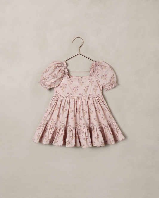 Noralee Florentine Louella Dress shown on a mannequin with floral patterns and flowing fabric, perfect for summer occasions.