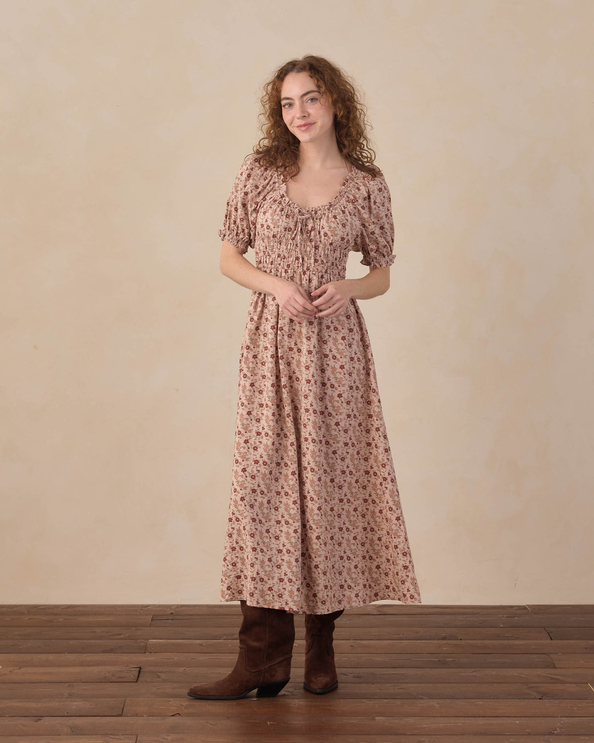 Women's pink floral Haisley dress by Rylee & Cru, featuring a flowy fabric and vibrant floral pattern on a sunny background.