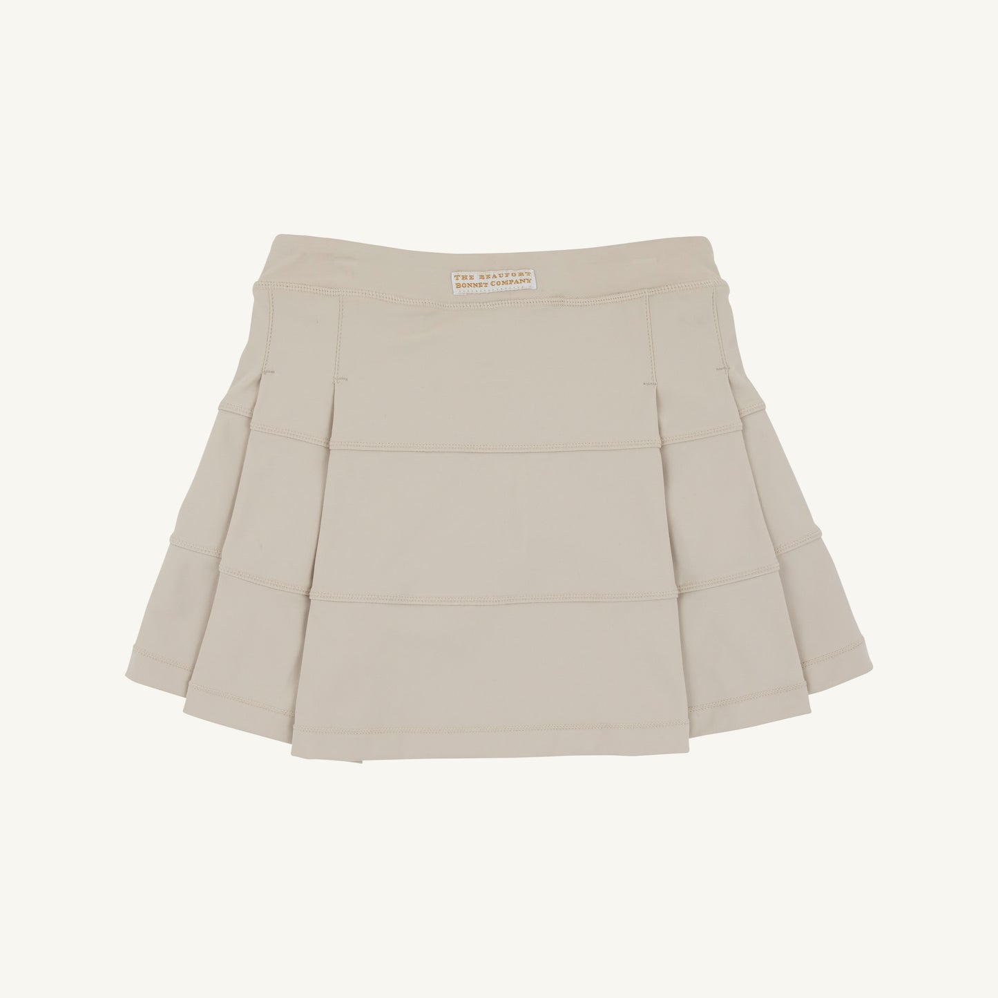 Keeneland Khaki and Palmetto Pearl PrepleticTM prep school skort by The Beaufort Bonnet Company, shown in khaki with pleats and a comfortable fit.