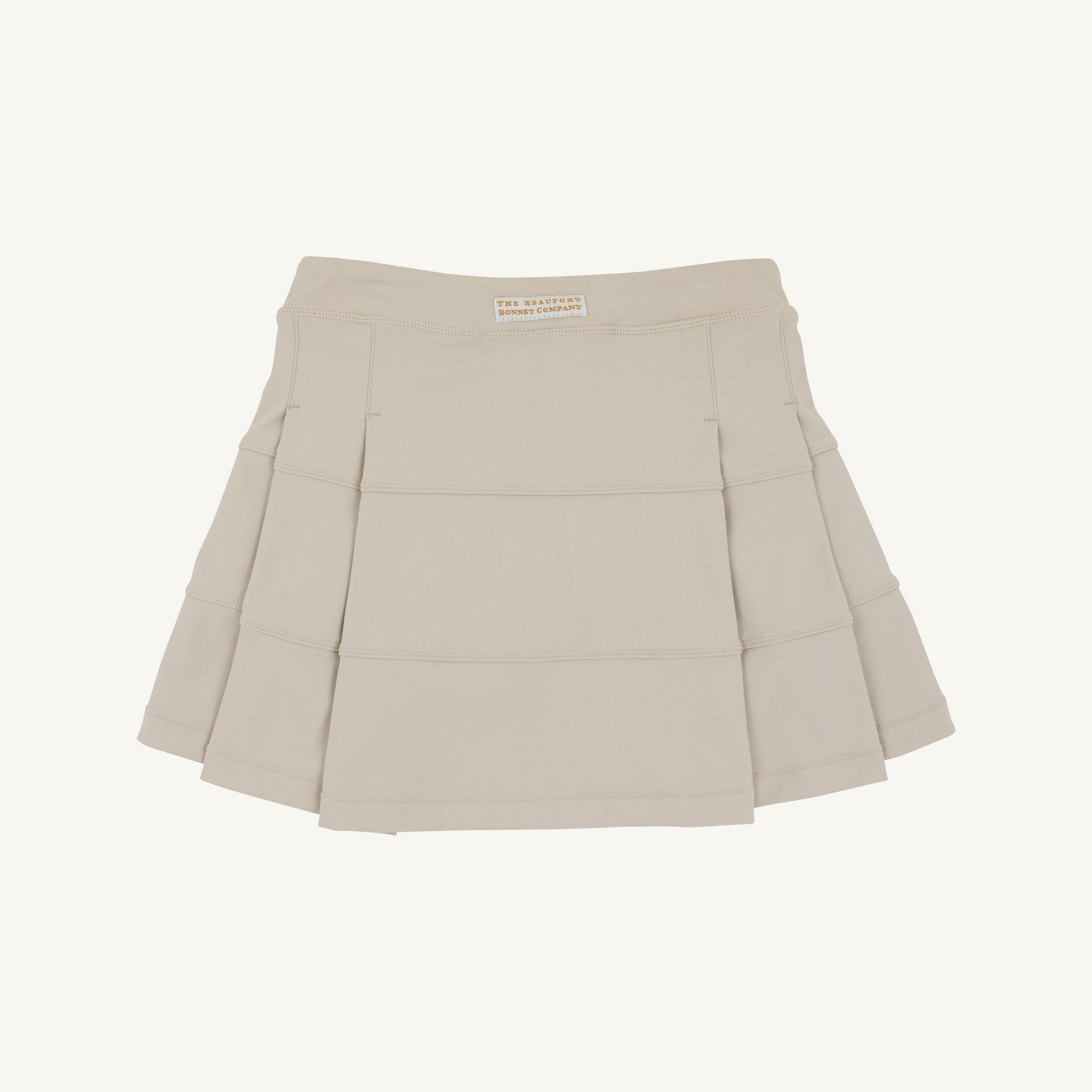Keeneland Khaki and Palmetto Pearl PrepleticTM prep school skort by The Beaufort Bonnet Company, shown in khaki with pleats and a comfortable fit.