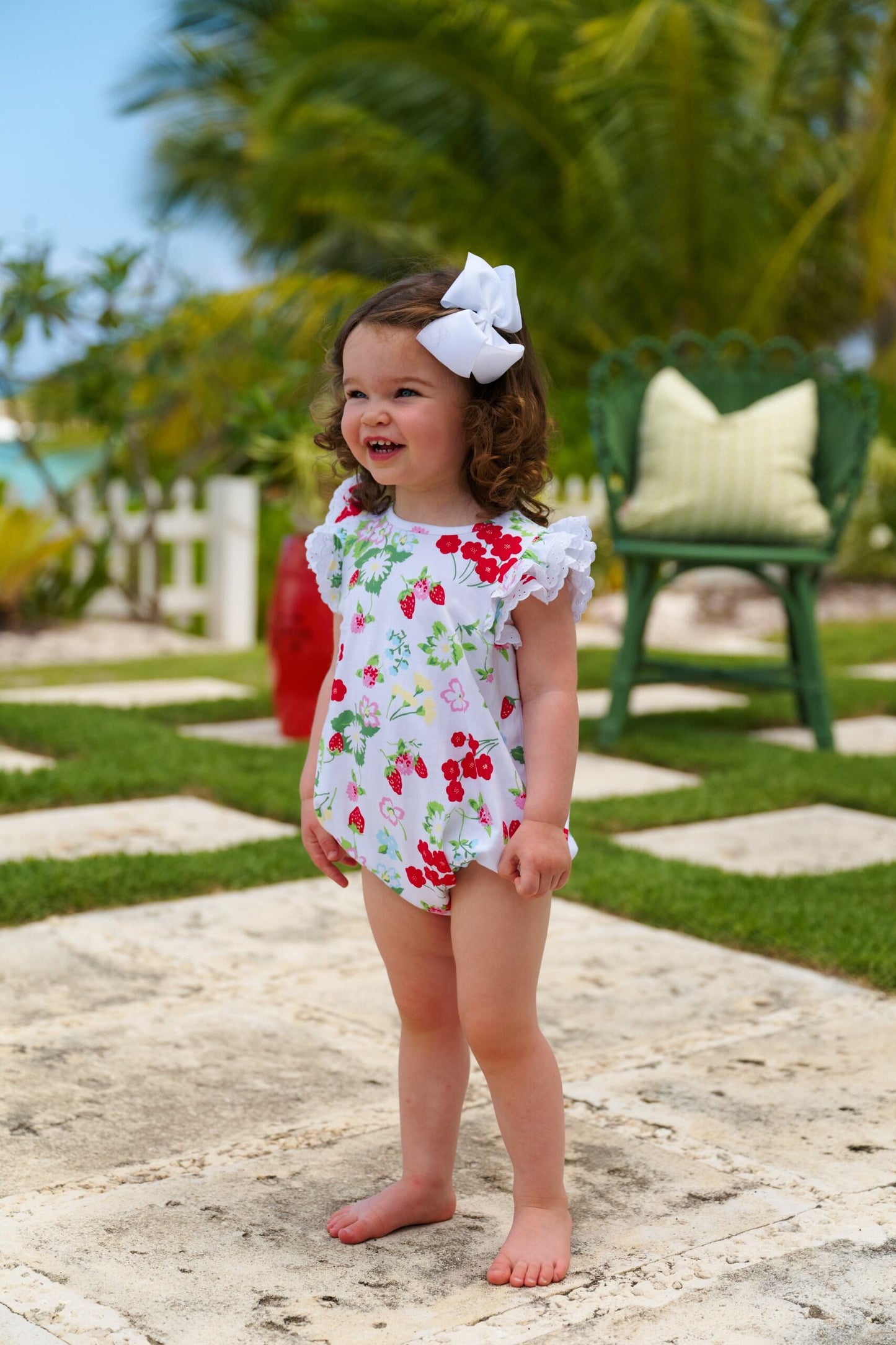 White Ruehling Ruffle Bubble from The Beaufort Bonnet Company featuring Berry Sweet/Worth Ave pattern on a charming baby bubble romper.