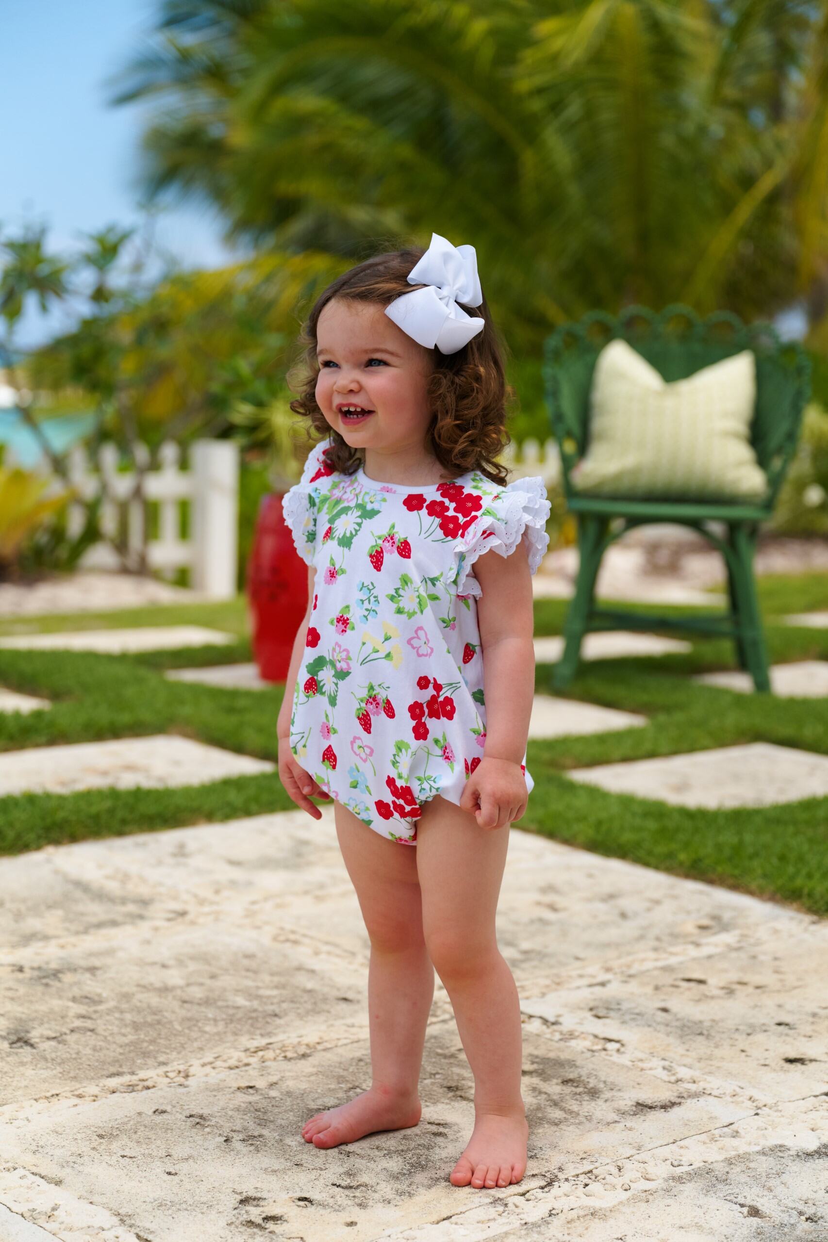 White Ruehling Ruffle Bubble from The Beaufort Bonnet Company featuring Berry Sweet/Worth Ave pattern on a charming baby bubble romper.