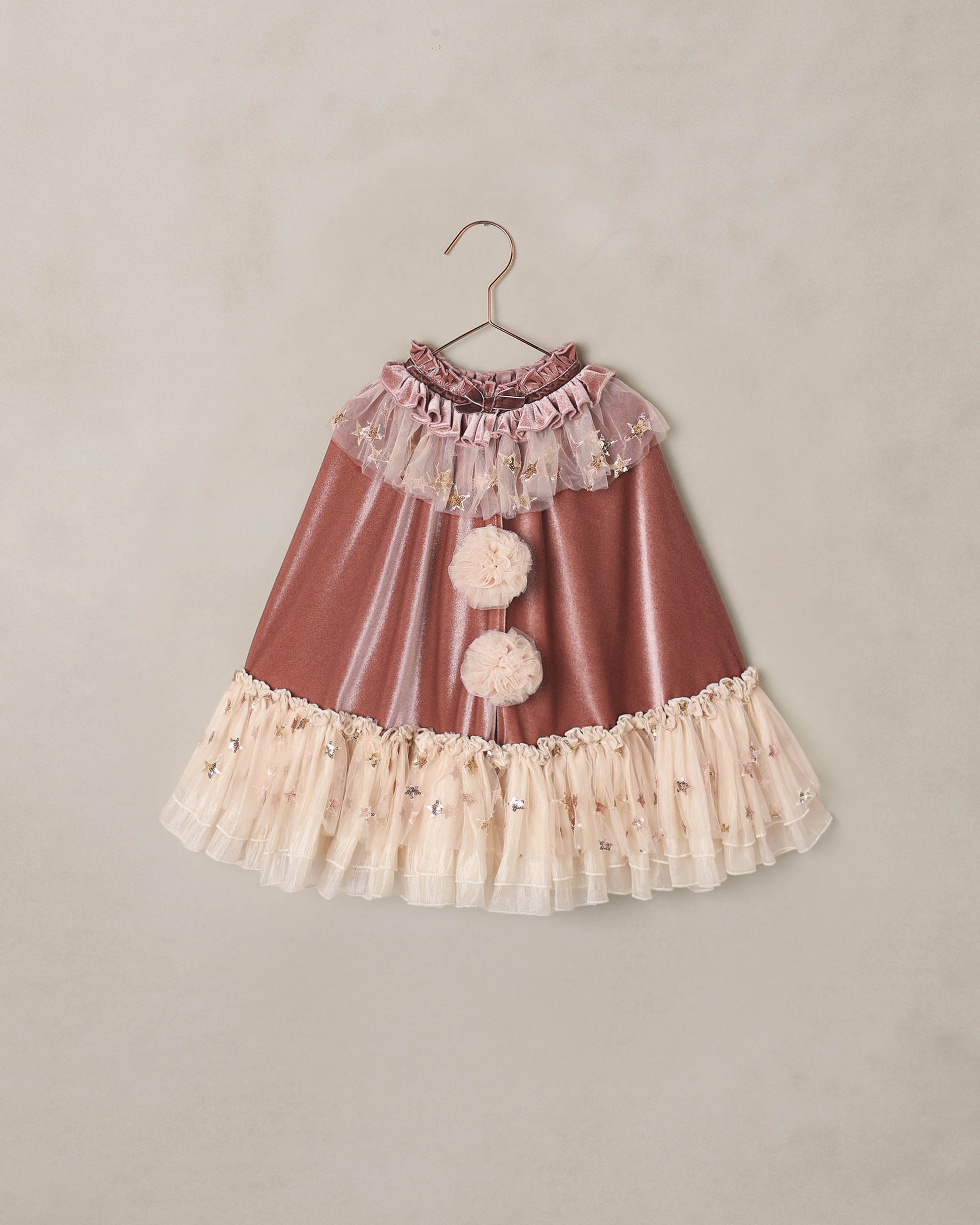 Noralee Spice Clown Cape featuring vibrant, colorful fabric with playful patterns, ideal for costumes or performances.