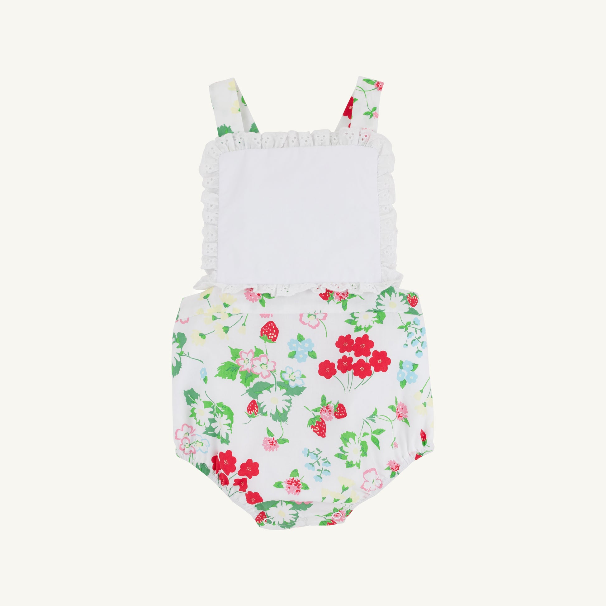 White Sally sunsuit for babies by The Beaufort Bonnet Company featuring berry and sweet print details.