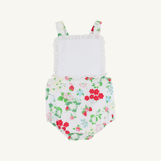 White Sally sunsuit for babies by The Beaufort Bonnet Company featuring berry and sweet print details.