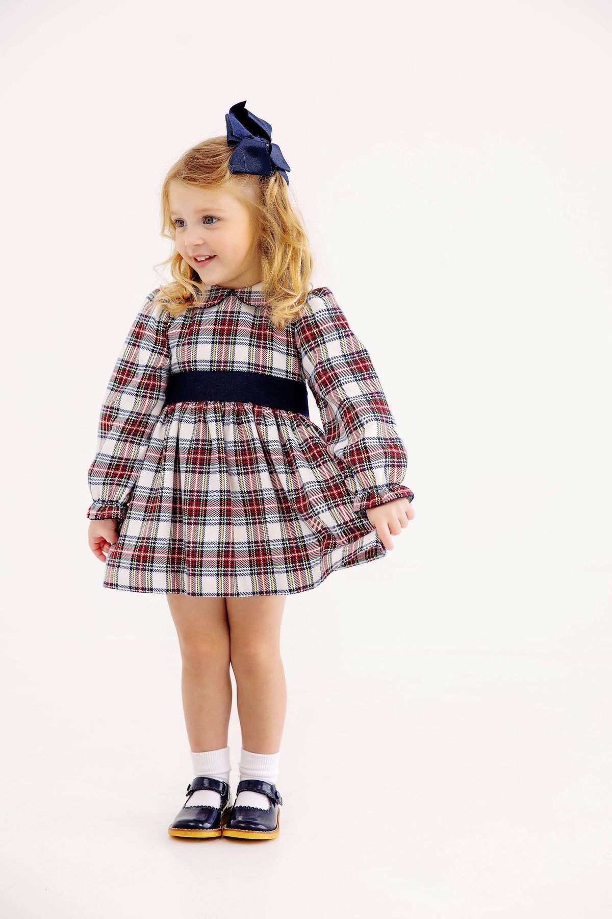 Long sleeve Nantucket Navy plaid Cindy Lou Sash Dress by The Beaufort Bonnet Company, featuring classic style and button details.