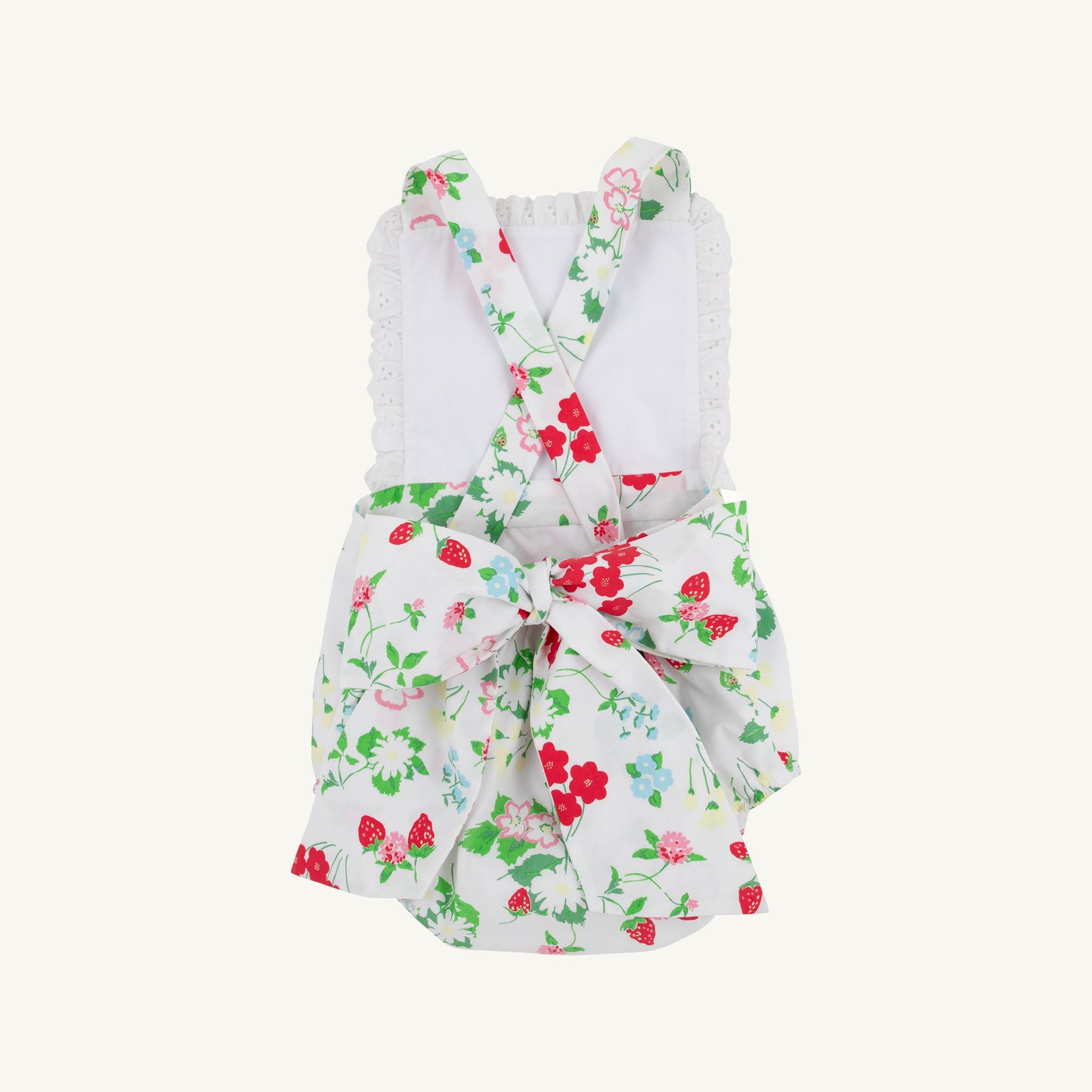 White Sally sunsuit for babies with berry sweet accents, from The Beaufort Bonnet Company, displayed on a neutral background.