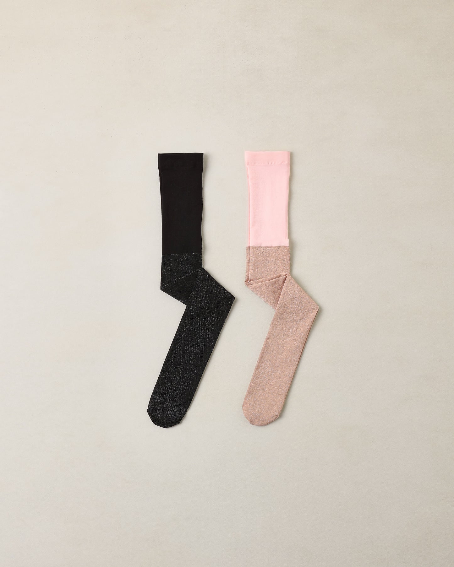 Black and blush shimmer tights by Noralee featuring a sheer, glossy finish and intricate design details.