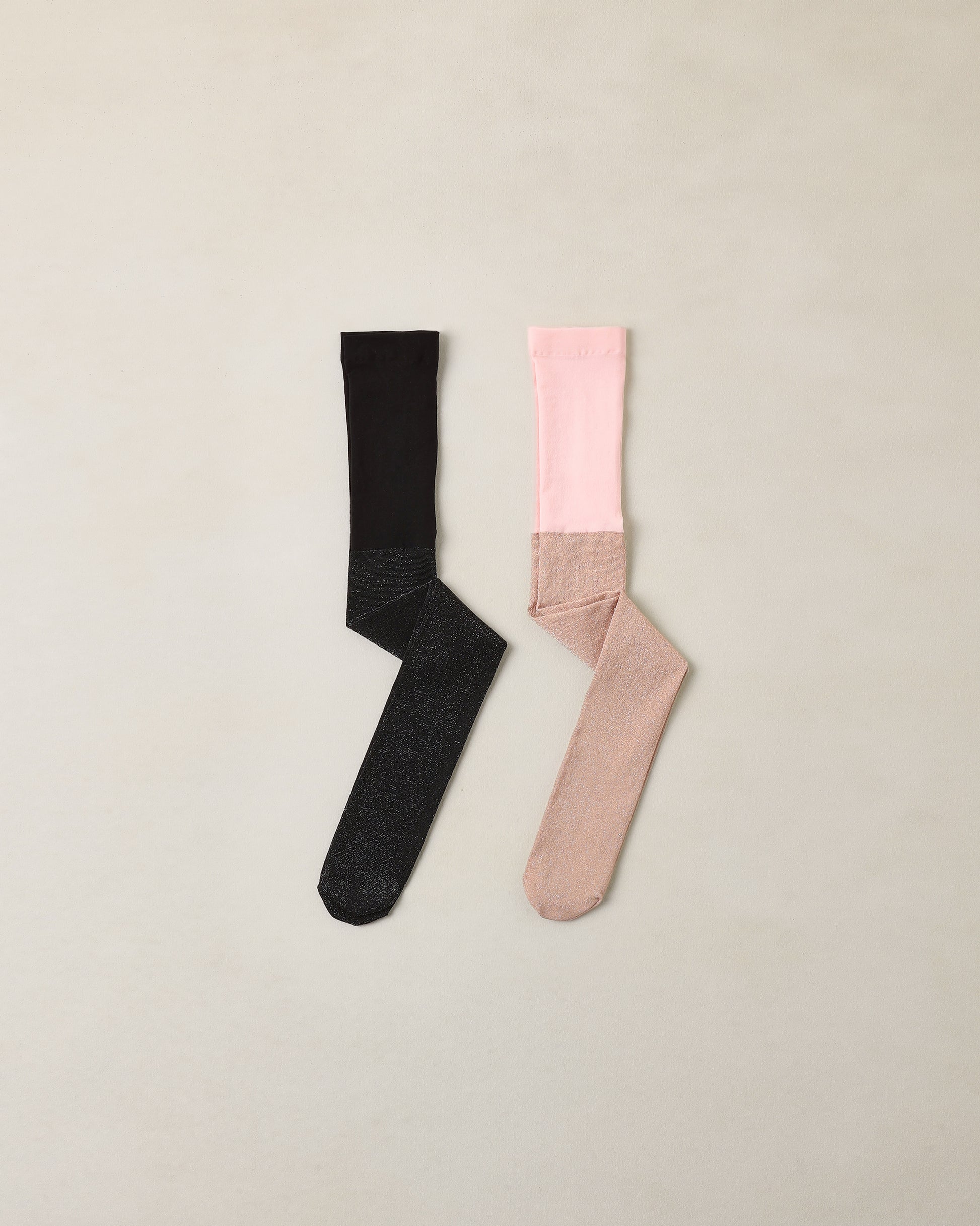 Black and blush shimmer tights by Noralee featuring a sheer, glossy finish and intricate design details.