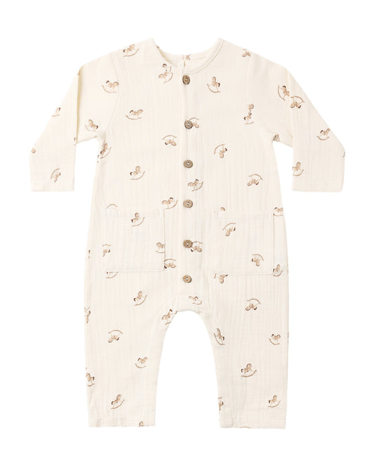 Quincy Mae rocking horse pocketed woven jumpsuit displayed on a hanger, featuring a playful design and soft fabric for children.