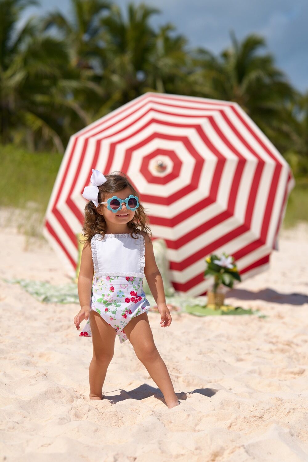 White Sally sunsuit for babies by The Beaufort Bonnet Company featuring berry and sweet design with comfortable fabric.