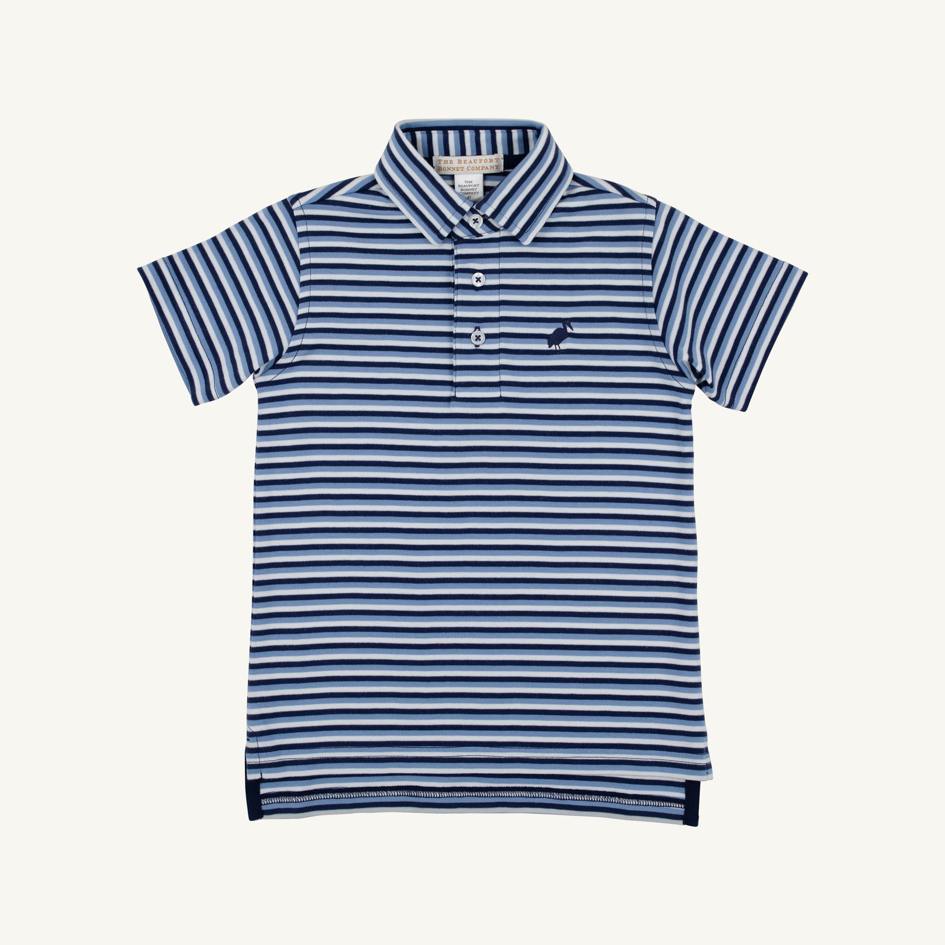 The Beaufort Bonnet Company Prim and Proper Polo featuring Sumner County Stripe in Barbados Blue and Nantucket Navy, styled on a child.