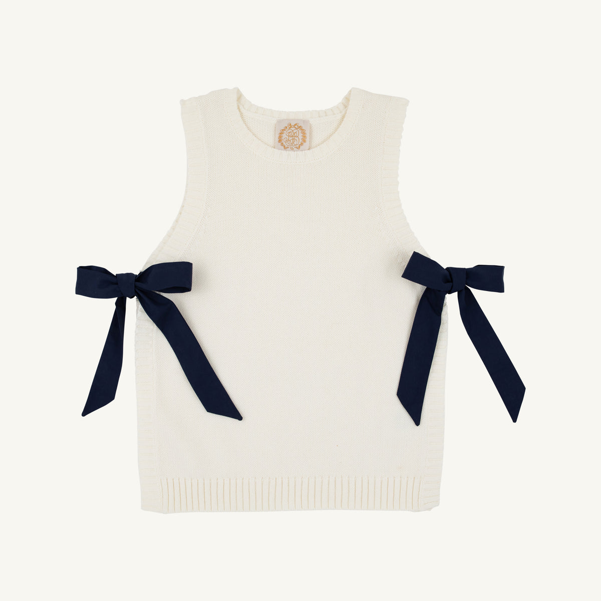 Nantucket Navy Shae sweater vest with palmetto pearl accents by The Beaufort Bonnet Company, shown on a model.