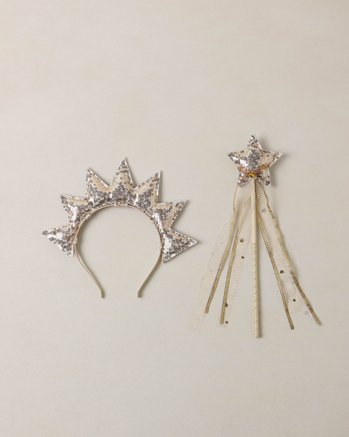 Gold sun crown and wand set by Noralee featuring a shiny gold crown with sun motifs and a matching gold wand for costume play.