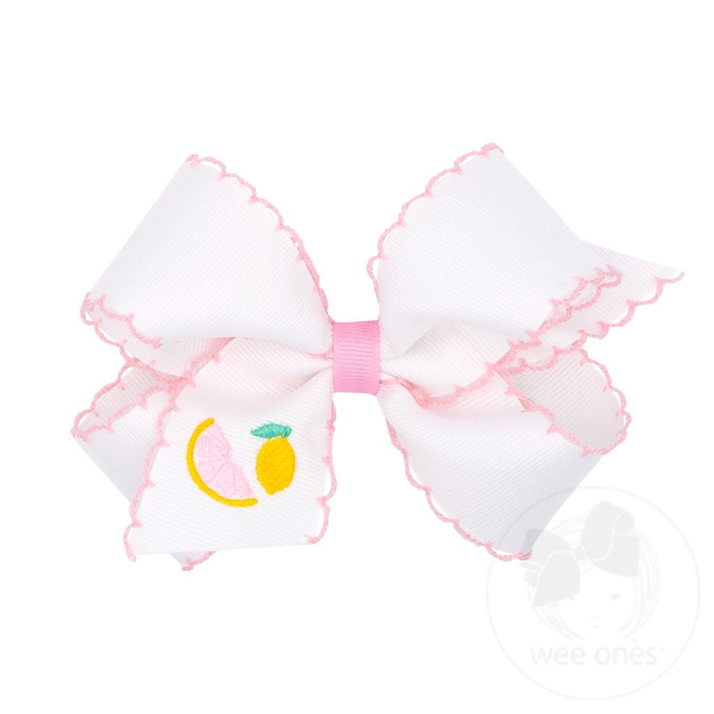 Colorful Wee Ones Moonstitch Edge and Summer Embroidery fabric swatches with intricate stitching and vibrant patterns.