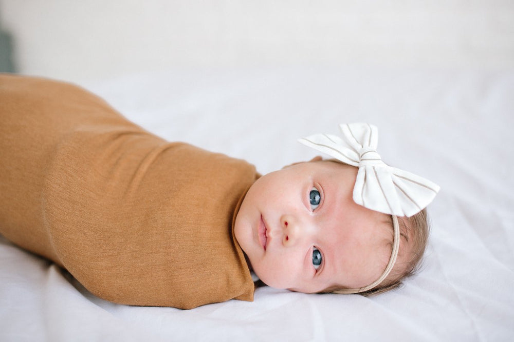 
            
                Load image into Gallery viewer, Copper Pearl Knit Swaddle - Camel
            
        